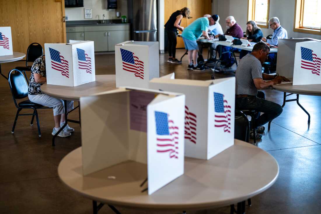 Voters fill out ballots at Lowe Park Arts and Environment Center on Tuesday in Marion, Iowa. Iowans voting in today's primary election will nominate candidates for governor, U.S. Senate, and U.S. House in advance of this fall's midterm elections.