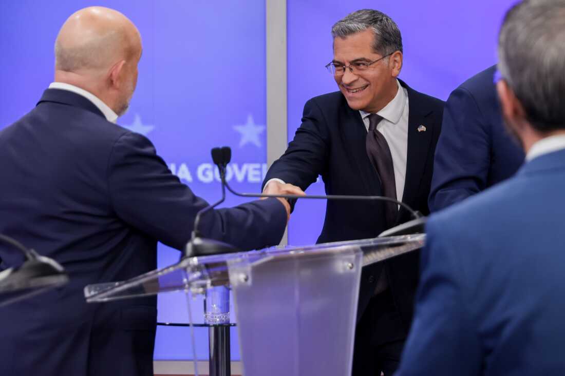 Xavier Becerra, Democratic gubernatorial candidate for California, and Steve Hilton, Republican gubernatorial candidate for California, shake hands while arriving for a gubernatorial debate at KRON Studios in San Francisco, California, US, on Wednesday, April 22, 2026.