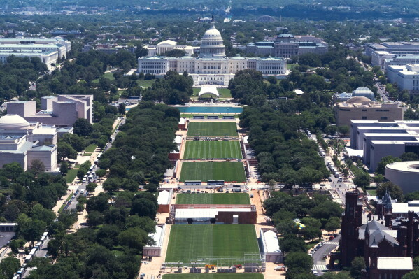 The U.S. Capitol backdrops the National Mall, where construction crews prepare the Mall for the 250th anniversary celebrations. (AP Photo/Manuel Balce Ceneta)
