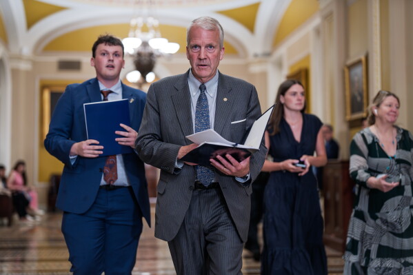 Sen. Dan Sullivan, R-Alaska, heads to a closed-door meeting with fellow Republicans, at the Capitol in Washington, Tuesday, June 2, 2026. (AP Photo/J. Scott Applewhite)