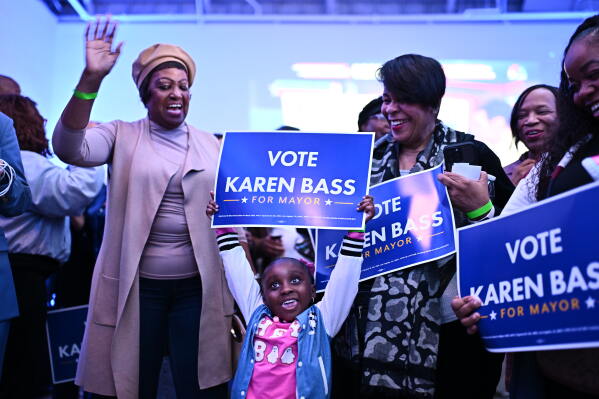 A young supporter holds a sign in support of Los Angeles Mayor Karen Bass during an election night event Tuesday, June 2, 2026, in Los Angeles. (AP Photo/William Liang)