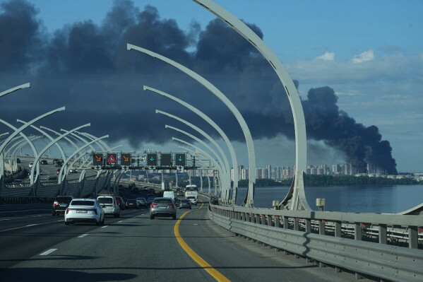 A plume of black smoke is seen over the port of St. Petersburg, Russia, Wednesday, June 3, 2026, after a Ukrainian drone attack. (AP Photo)