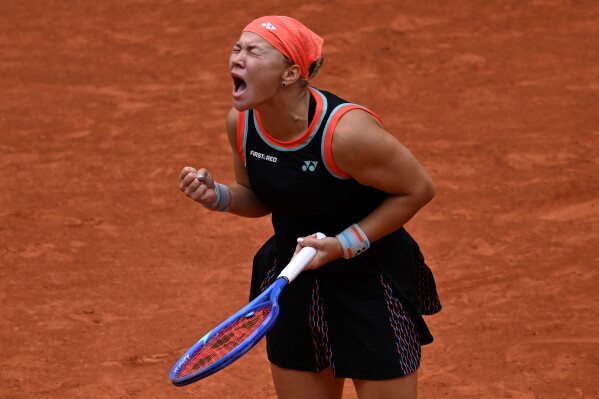 Russia's Diana Shnaider reacts after winning the quarterfinal tennis match against Aryna Sabalenka of Belarus at the French Open in Paris, Wednesday, June 3, 2026. (AP Photo/Emma Da Silva)