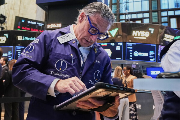 Trader John Romolo works on the floor of the New York Stock Exchange, Wednesday, June 3, 2026. (AP Photo/Richard Drew)