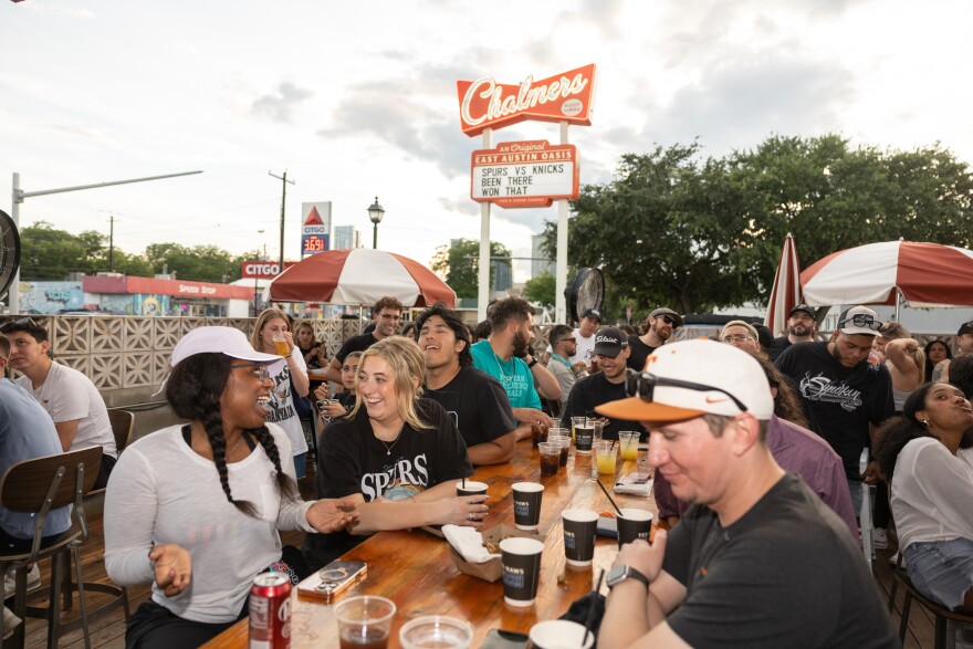 Jade Scott, left, and Peyton Brewster attend the Chalmers watch party. Hundreds of people came out to the bar for Game 1.