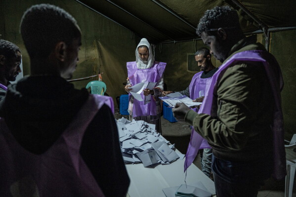 National Election Board of Ethiopia officials sort and count ballots at the Shalla Park polling station during the general election in Addis Ababa, Ethiopia, Tuesday, June 2, 2026. (AP Photo/Amanuel Sileshi)