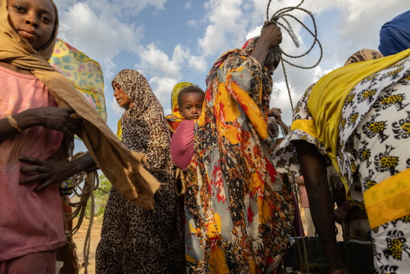 Women fetch water at dusk in the Korsi Refugee Camp in Birao, Central African Republic, Thursday, March 26, 2026. (AP Photo/Caitlin Kelly)