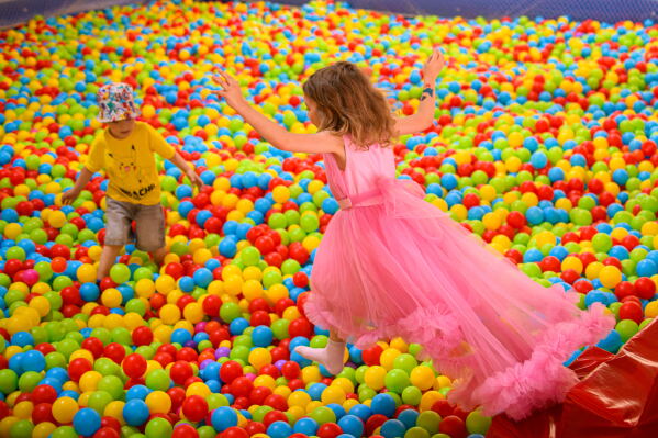Children play during a Children's Day event in Bucharest, Romania, Sunday, May 31, 2026. (AP Photo/Alexandru Dobre)