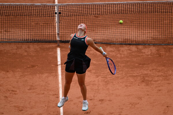 Russia's Diana Shnaider reacts after winning the quarterfinal tennis match against Aryna Sabalenka of Belarus at the French Open in Paris, Wednesday, June 3, 2026. (AP Photo/Emma Da Silva)