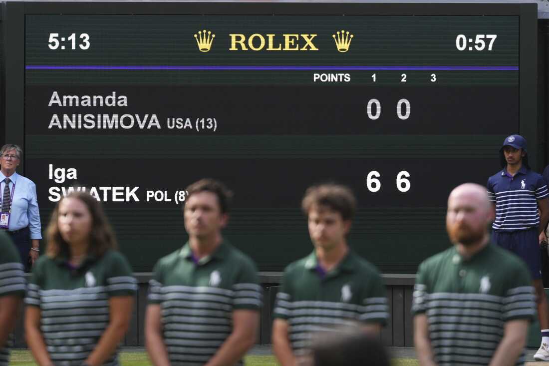 The scoreboard shows the results of the women's singles final match between Iga Swiatek of Poland and Amanda Anisimova of the U.S. at the Wimbledon Tennis Championships in London, Saturday, July 12, 2025.