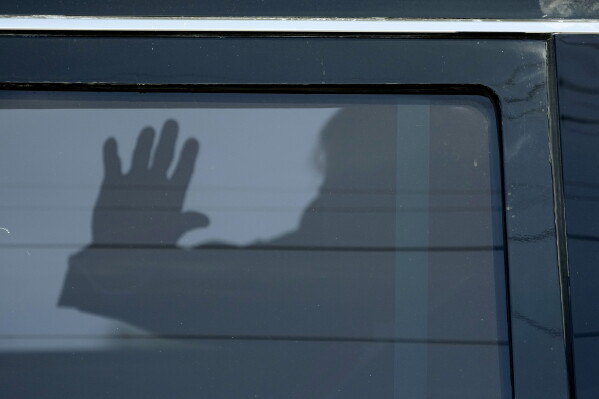 Former President Donald Trump waves to supporters as he leaves federal court, March 14, 2024, in Fort Pierce, Fla. (AP Photo/Wilfredo Lee, File)