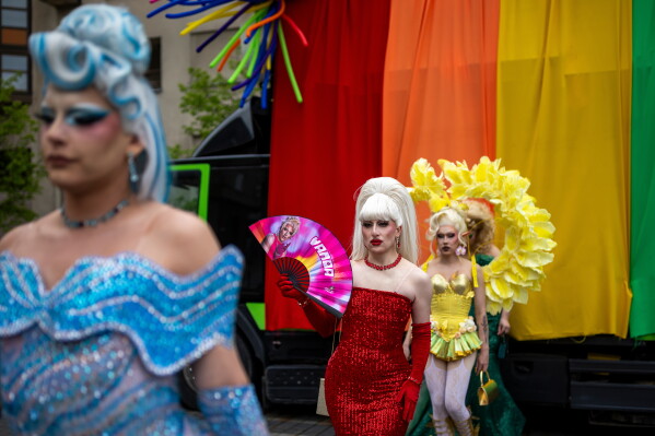 Revelers take part in a Pride parade in Vilnius, Lithuania, Saturday, June 6, 2026. (AP Photo/Mindaugas Kulbis)