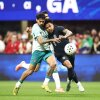 Weston McKennie of the United States (right) and Samu Costa of Portugal compete for the ball during a match in Atlanta on Tuesday. Portugal defeated the U.S. 2-0, giving the USMNT another disappointing loss ahead of this summer's World Cup.