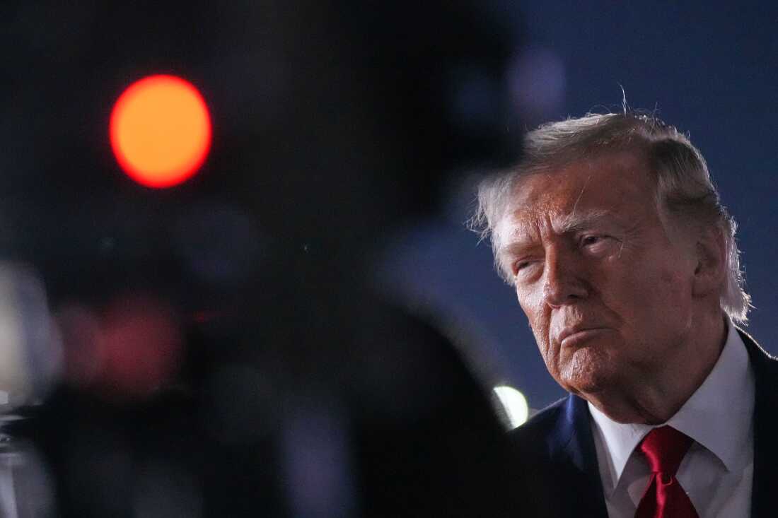 President Donald Trump talks with reporters before boarding Air Force One at John F. Kennedy International Airport in New York, early Tuesday, June 9, 2026.