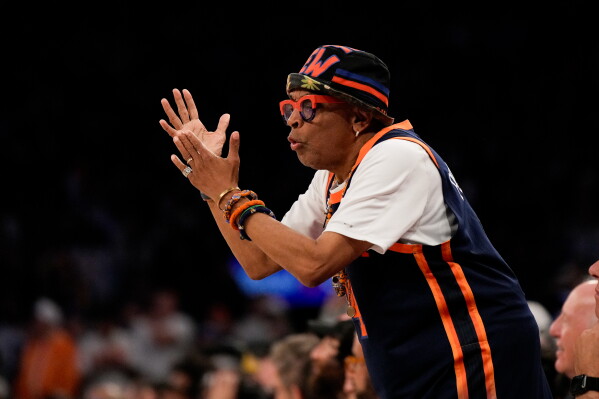 Filmmaker Spike Lee cheers during Game 3 of the NBA Finals basketball series between the San Antonio Spurs and the New York Knicks, Monday, June 8, 2026, in New York. (AP Photo/Ross D. Franklin)