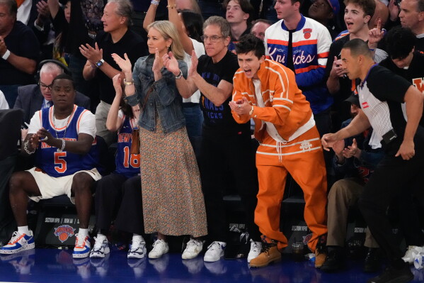 Timothee Chalamet, right, and Ben Stiller cheer during Game 3 of the NBA Finals basketball series between the San Antonio Spurs and the New York Knicks, Monday, June 8, 2026, in New York. (AP Photo/Ross D. Franklin)