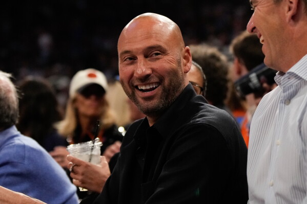 Former New York Yankee Derek Jeter smiles during Game 3 of the NBA Finals basketball series between the San Antonio Spurs and the New York Knicks, Monday, June 8, 2026, in New York. (AP Photo/Ross D. Franklin)