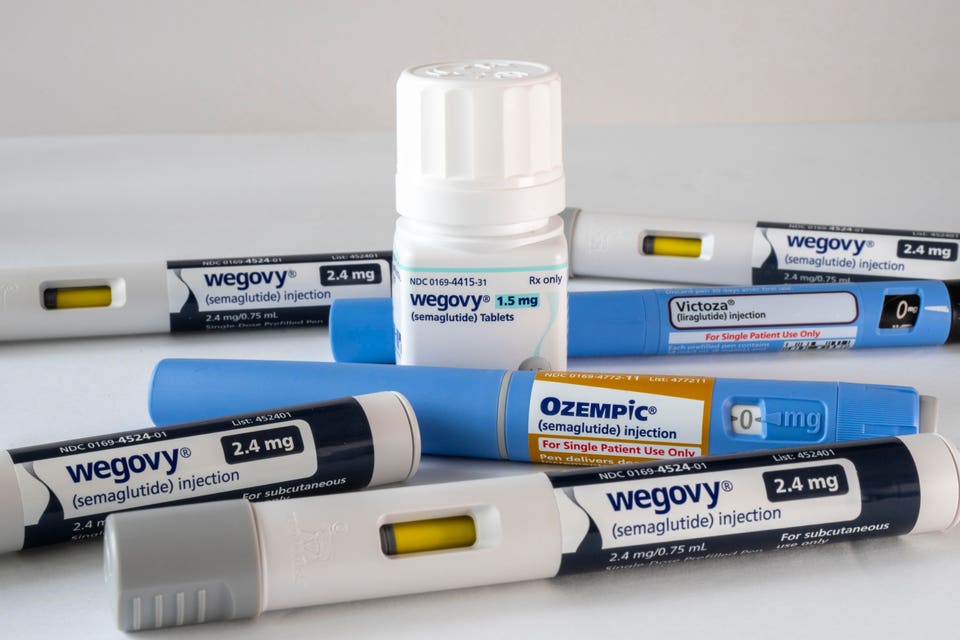 Wegovy tablets with injectable prescription weight loss medicines, Ozempic, Victoza and Wegovy on a white background