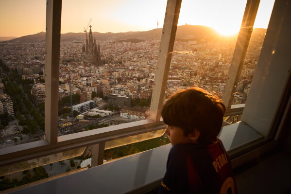 Antoni Gaudí's Basilica of the Sagrada Família stands at dusk as seen from the Mirador Torre Glòries in Barcelona, Spain, Tuesday, June 9, 2026. (AP Photo/Emilio Morenatti)