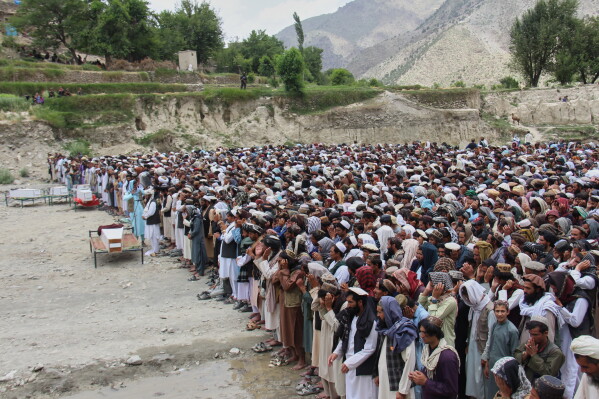 Mourners pray during a funeral for victims, including children, of airstrikes that Taliban officials said were carried out by Pakistan, in Mana, a village in Afghanistan's Khost province, Wednesday, June 10, 2026. (AP Photo/Saifullah Zahir)