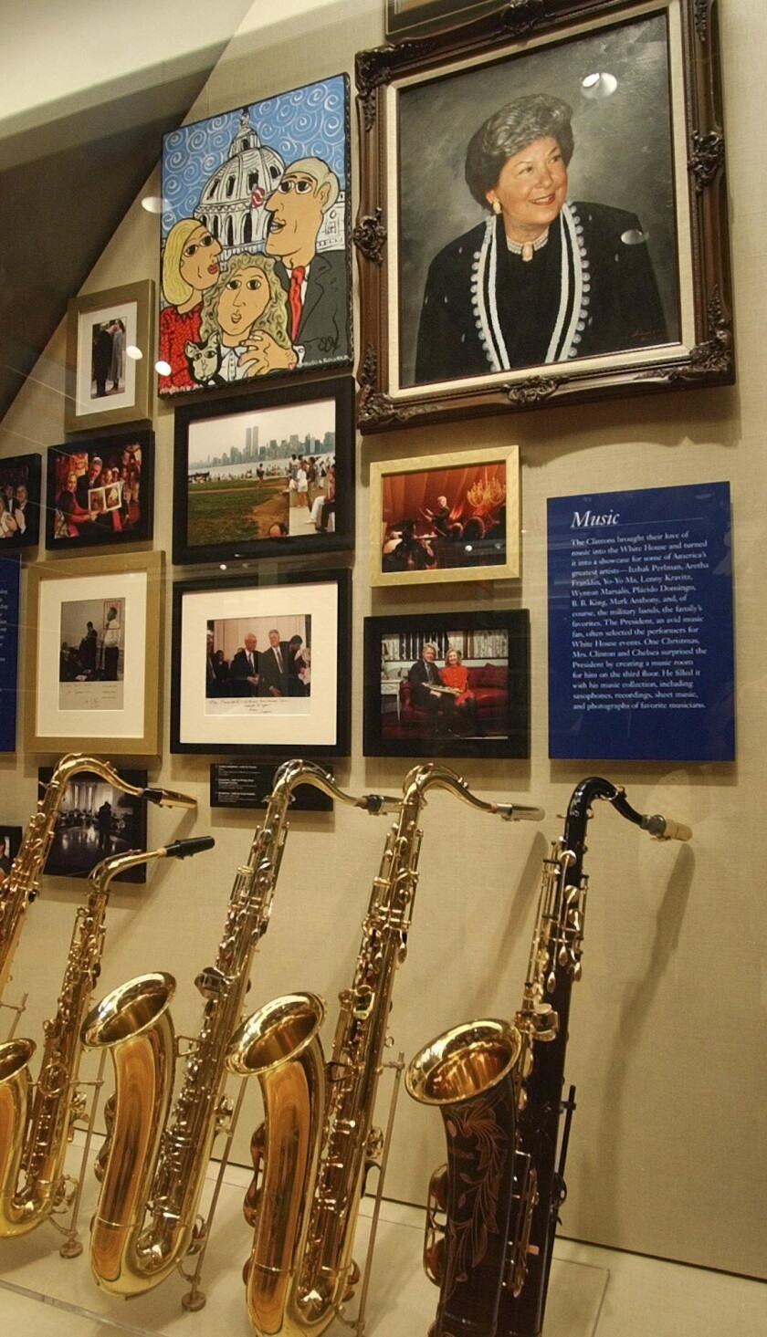 Saxophones and a portrait of Virginia Kelley, former President Bill Clinton's mother, top right, are among items displayed at the Clinton Presidential Library in Little Rock, Arkansas.