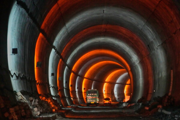 Vehicles drive through the Zojila Tunnel following its breakthrough ceremony at Minamarg in Ladakh, India, Tuesday, June 9, 2026. (AP Photo/Mukhtar khan)