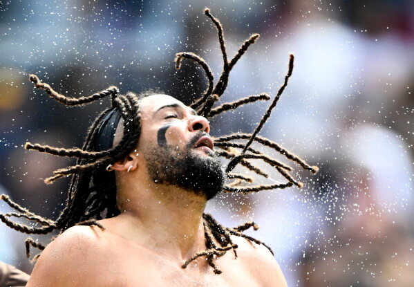 San Diego Padres' Fernando Tatis Jr. (23) celebrates after hitting a walk-off home run during the ninth inning of a baseball game against the Cincinnati Reds Wednesday, June 10, 2026, in San Diego. (AP Photo/Denis Poroy)