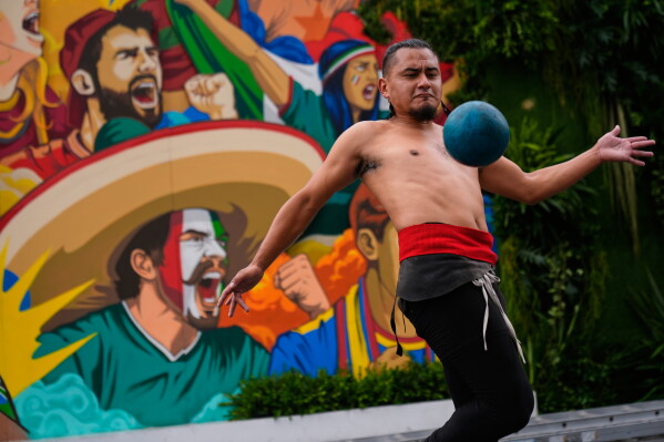 Aztlán Tenochtitlan plays ulama, a traditional Mesoamerican ball game dating back to pre-Hispanic times in Mexico City, Tuesday, June 9, 2026. (AP Photo/Marco Ugarte)
