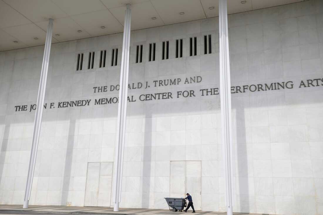 A man wheels a garbage bin outside of The John. F. Kennedy Center for the Performing Arts, Saturday, June 6, 2026, in Washington.