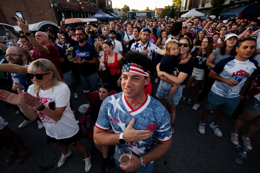 A United States fan puts his hand over his heart during the National Anthem before the US Men’s National Team takes on Paraguay during the FIFA World Cup on Friday, June 12, 2026, outside of Amsterdam Tavern in south St. Louis.