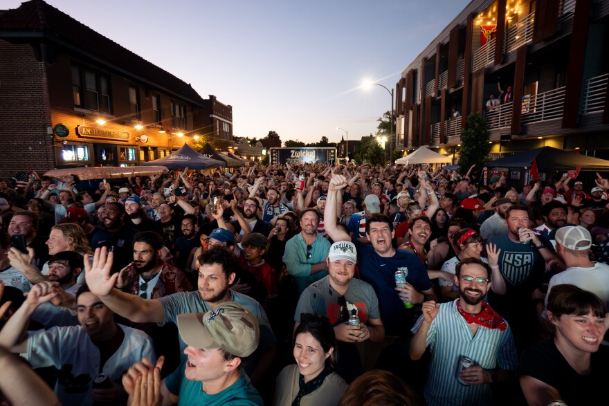 Hundreds of United States fans celebrate as the team routs Paraguay, 4-1, during a FIFA World Cup watch party outside of Amsterdam Tavern on Friday, June 12, 2026, in south St. Louis.