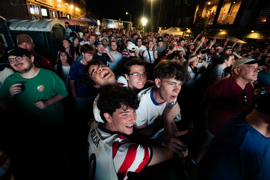 United States fans celebrate as the team routs Paraguay, 4-1, during a FIFA World Cup watch party outside of Amsterdam Tavern on Friday, June 12, 2026, in south St. Louis.