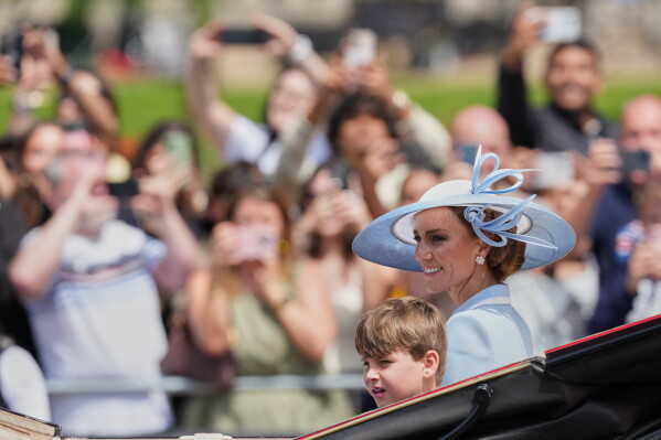 Kate, Princess of Wales and her son Prince Louis return to Buckingham Palace during Trooping The Colour, the King's annual birthday parade, in London, Saturday, June 13, 2026. (AP Photo/Kirsty Wigglesworth)