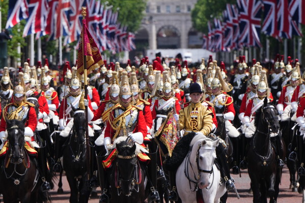 Members of the Household Cavalry ride back from Trooping The Colour, the King's annual birthday parade, in London, Saturday, June 13, 2026. (AP Photo/Kirsty Wigglesworth)