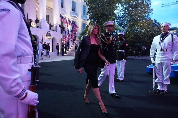 First lady Melania Trump walks out to the UFC Freedom 250 on the South Lawn of the White House, Sunday, June 14, 2026, in Washington. (AP Photo/Julia Demaree Nikhinson)