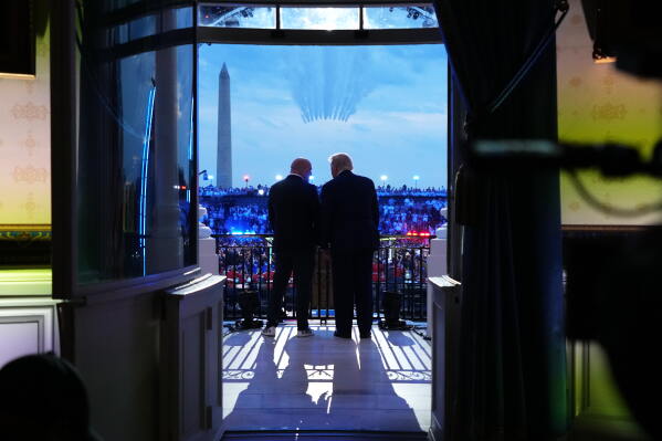 President Donald Trump and UFC President and CEO Dana White watch the U.S. Air Force Thunderbirds and U.S. Navy Blue Angels perform a fly over the White House during the UFC Freedom 250 fights on the South Lawn of the White House, Sunday, June 14, 2026, in Washington. (AP Photo/Jacquelyn Martin, Pool)