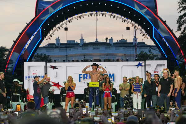 Diego Lopes participates in the ceremonial UFC Freedom 250 weigh-ins on the Ellipse, Saturday, June 13, 2026, in Washington, ahead of Sunday's fight on the South Lawn of the White House. (AP Photo/Julia Demaree Nikhinson)