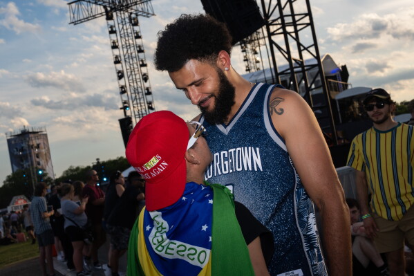 Isaiah Francisco and Eric Albarracin at the UFC Fan Fest on the White House Ellipse ahead of Sunday's fight on the South Lawn, Saturday, June 13, 2026, in Washington. (AP Photo/Allison Robbert)