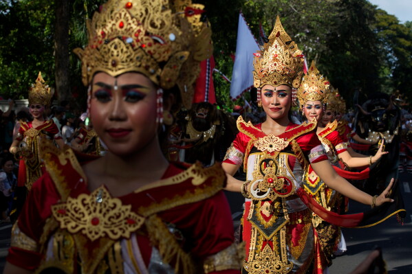 Dancers perform during a parade marking the opening of the annual Bali Arts Festival in Denpasar, Bali, Indonesia, Saturday, June 13, 2026. (AP Photo/Firdia Lisnawati)