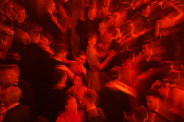 Students dance a waltz during "The Debutantes' Ball," an annual event that brings together the students from Moscow and St. Petersburg, in the Marble Hall of the Russian Ethnographic Museum in St. Petersburg, Russia, Friday, June 12, 2026. (AP Photo/Dmitri Lovetsky)