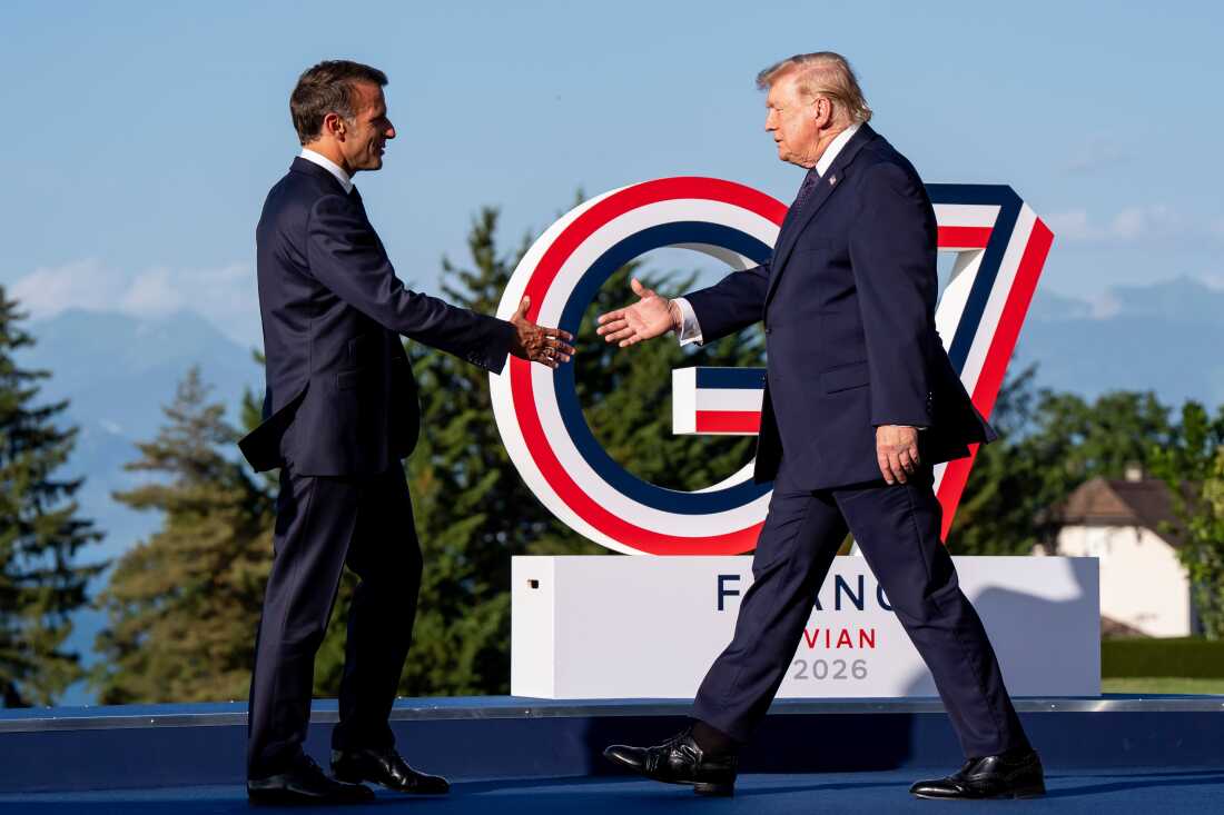 Emmanuel Macron, President of France, left, greets U.S. President Donald Trump during the G7 summit in Evian-les-Bains, France, Monday, June 15, 2026. (Christopher Katsarov/The Canadian Press via AP)