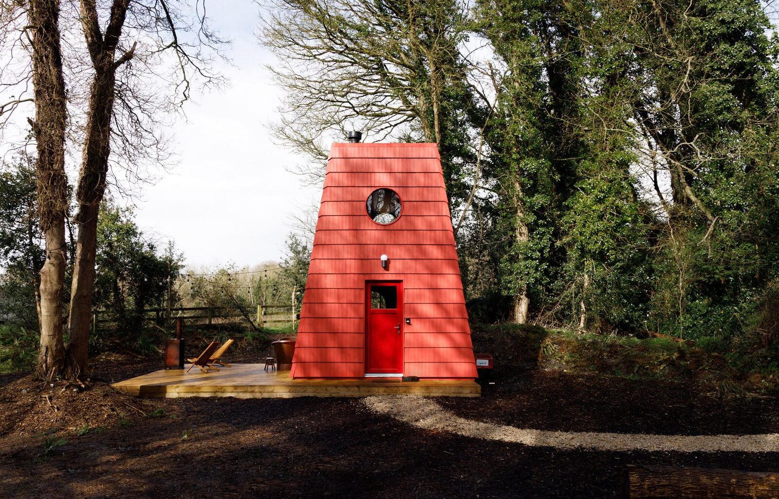 This Tiny Red Cabin Has a Lockbox for Your Phone
