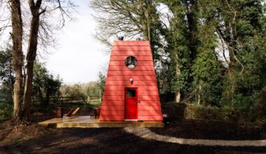 This Tiny Red Cabin Has a Lockbox for Your Phone