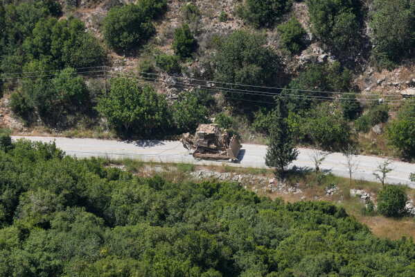 An Israeli army bulldozer drives through Wadi al-Hujeir in southern Lebanon, Tuesday, June 16, 2026. (AP Photo/Mohammed Zaatari)