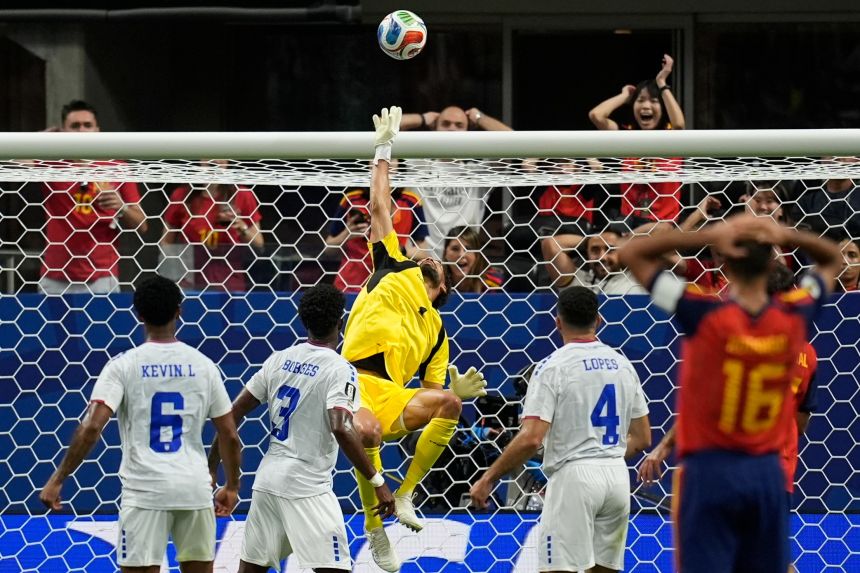 Cape Verde goalkeeper Vozinha makes a save against Spain on Monday.