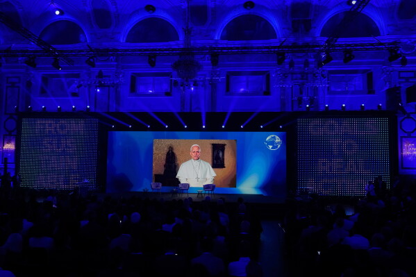 Pope Leo XIV. Appears on a screen at the "Austrian World Summit - The Schwarzenegger Climate Initiative" in Vienna, Austria, Tuesday, June 16, 2026. (AP Photo/Matthias Schrader)