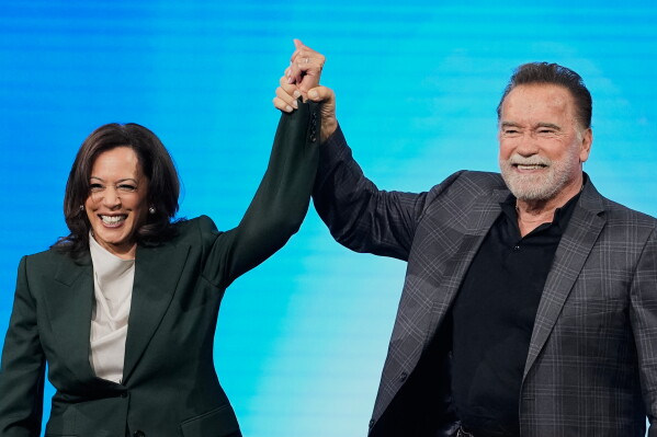 Arnold Schwarzenegger, right, and Kamala Harris, left, attend the "Austrian World Summit - The Schwarzenegger Climate Initiative" in Vienna, Austria, Tuesday, June 16, 2026. (AP Photo/Matthias Schrader)