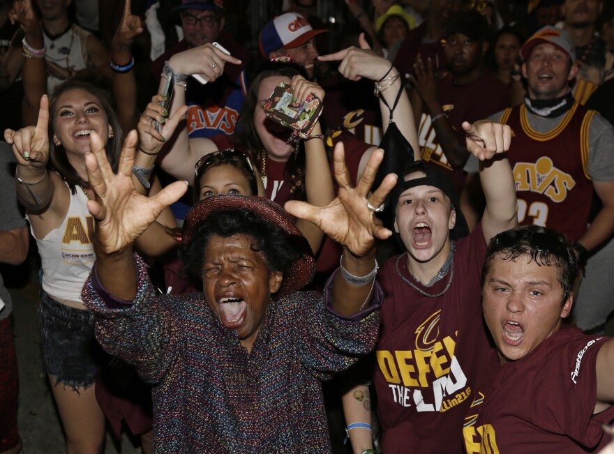 Cleveland Cavaliers fans celebrate after the Cavaliers defeated the Golden State Warriors 93-89 in Game 7 of the NBA basketball Finals, Sunday, June 19, 2016, in Cleveland.