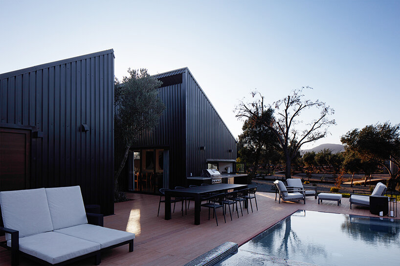 two corrugated metal volumes shelter courtyard retreat in mexico's desert landscape - 7