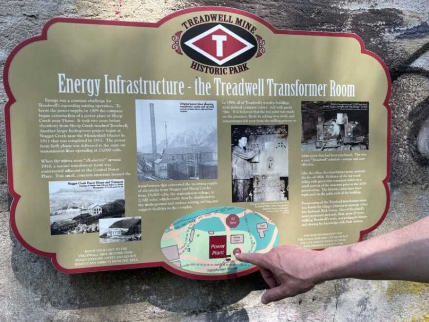 Day oil tank 8 is next to the transformer room of the Central Power Plant, as seen on an interpretive sign.